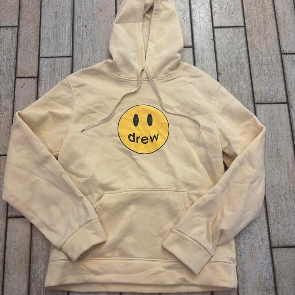 Drew House cream hoodie with yellow smiley face graphic